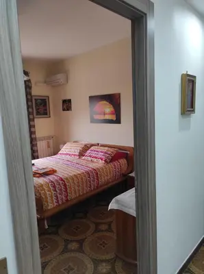 a bedroom with a bed in a room at Camera a Palermo in Mondello