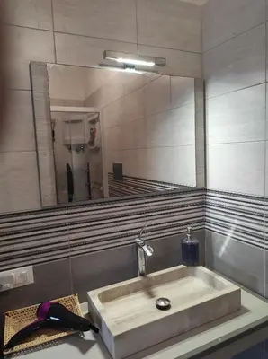 a bathroom with a sink and a mirror at Camera a Palermo in Mondello