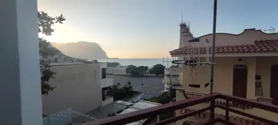 a view of the ocean from the balcony of a building at Villa Sole in Palermo