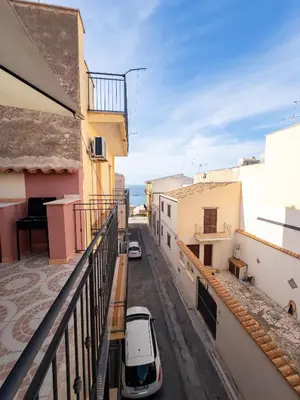 a car parked on a balcony of a building at Terrazza Bellini in Castellammare del Golfo