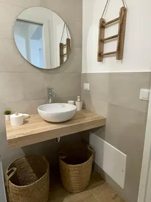 a bathroom with a sink and a mirror at Dai Palermitani Rooms & Apartments in Palermo