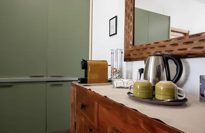 a kitchen with a counter with a tea kettle on it at Palazzo Monteleone Suite in Palermo