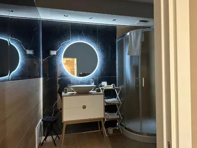 a bathroom with a sink and a mirror at IL Cavaliere in Palermo