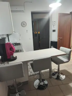 a kitchen with a table and two chairs at Casa Felice in Misilmeri