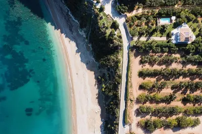 an overhead view of a beach and the ocean at Villa Perla Di Guidaloca in Scopello