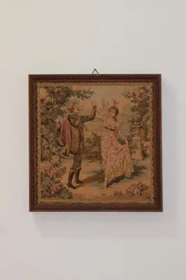 a painting of a man and a woman on a wall at Al Palazzo Del Principe al Massimo in Palermo