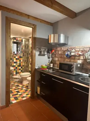 a kitchen with a sink and a toilet in a room at BLU Fronte Mare in Palermo