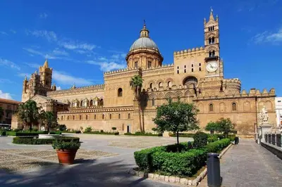 a large building with a clock tower on top of it at Orleans Apartment in Palermo
