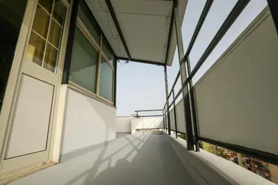 an empty balcony of a building with windows at Medea Suite Panoramic in Palermo