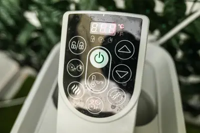a remote control sitting on top of a phone at Medea Suite Panoramic in Palermo