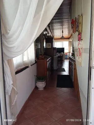 a hallway of a kitchen with a curtain over the door at Terrazza Mare Mondello in Palermo