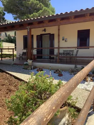 a house with a fence in front of it at Macari House in Macari