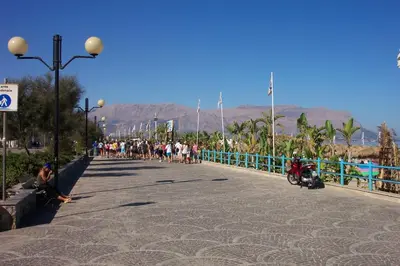 a group of people walking down a street at VILLA BUTTERFLY 2 a FEW STEPS FROM THE SEA in Capaci