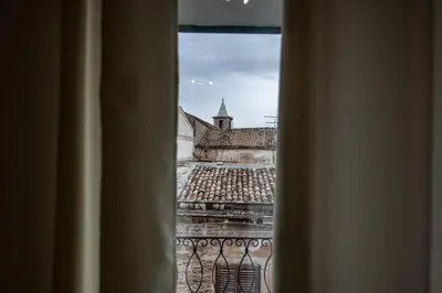a view of a church from a window at Molinari Palermo in Palermo