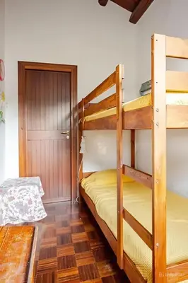 a bedroom with a large bed in a room at Alle due Torri, villa sulla roccia a picco sul mare in Altavilla Milicia