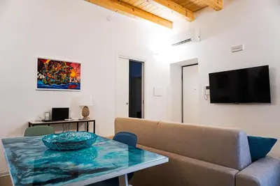 a living room with a couch and a table at Crihouse in Palermo