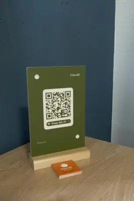a green book with a picture of a circuit board at Appartamento completo con parcheggio privato - Villa Ciaculli in Villabate