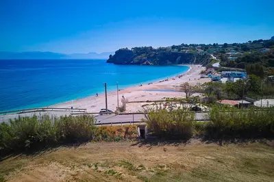 a view of a beach with people on it at Villa Ninfa in Castellammare del Golfo