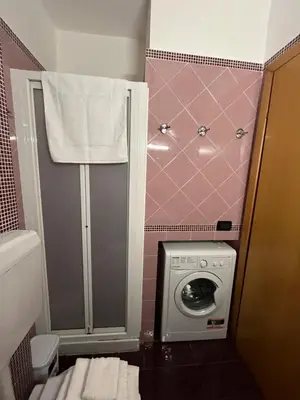 a bedroom with a bed with towels on it at VillettaletreGi in Campofelice di Roccella
