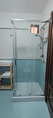 a shower with a glass door in a bathroom at Casa Vacanze In Piazza in Terrasini