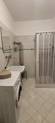 a bathroom with a toilet and a sink and a shower at Casa Vacanze In Piazza in Terrasini