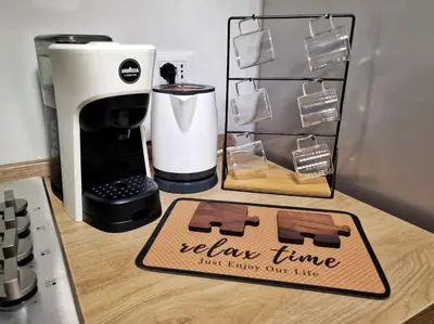 a coffee maker and a sign on a counter at DIMORA SAITTA per SAITTA HOLIDAYS in Palermo
