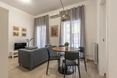 a living room with a table and a couch at La casa sul Mercato by Wonderful Italy in Palermo
