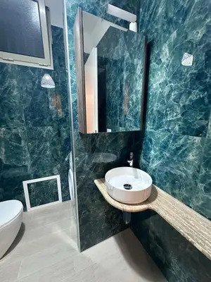 a bathroom with a sink and a mirror at Mondello Telemaco Beach in Palermo