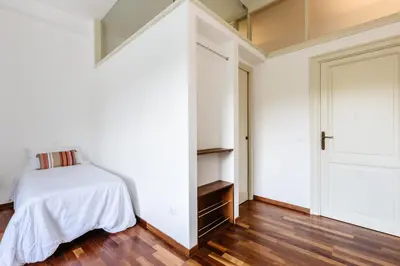 a bedroom with a bed and a closet at Piazza Marina Suite By DomuSicily in Palermo