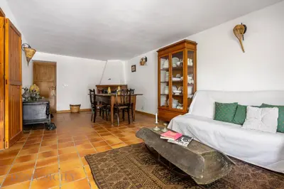 a living room with a couch and a table at La Gurra Tenuta Migliore By DomuSicily in Chiusa Sclafani