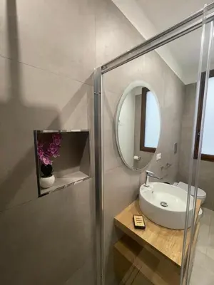 a bathroom with a sink and a mirror at Olea in Castelluzzo