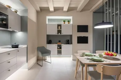 a kitchen and dining room with a table and chairs at Cathedral Room&Loft in Palermo