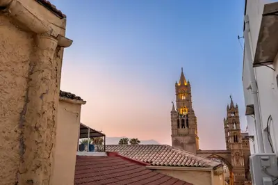a view of a church with a clock tower at Cathedral Room&Loft in Palermo