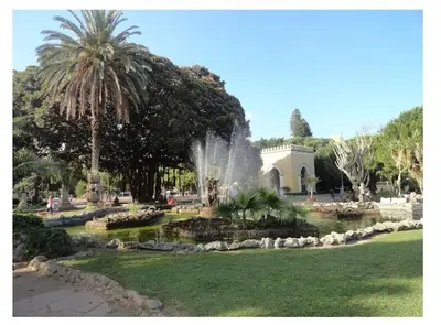 a fountain in the middle of a park at D'Amelio Sweet Home in Palermo