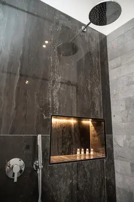 a bathroom with a shower with a glass wall at Casa Degli Aragonesi in Palermo