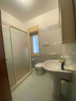 a bathroom with a shower and a toilet and a sink at Nonna Giovanna in Castellammare del Golfo