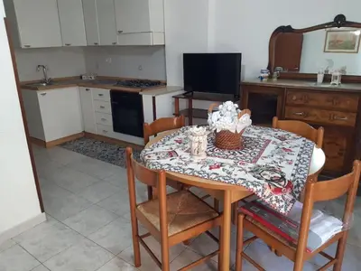 a kitchen with a table with a table cloth on it at Nonna Giovanna in Castellammare del Golfo