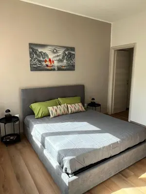 a bedroom with a large bed in a room at LaPignaVerde Suites in Palermo
