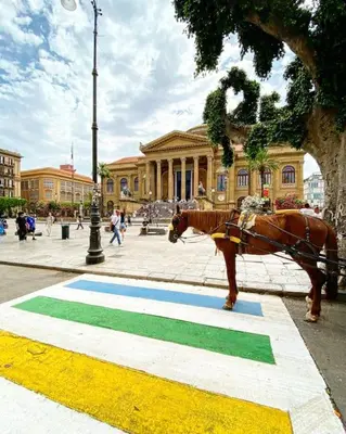 a horse statue standing in front of a building at 145 Maqueda Palermo in Palermo