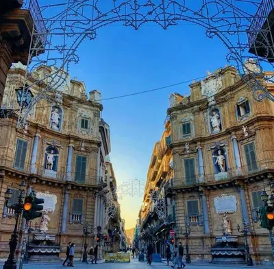 a group of buildings with people walking in front of them at 145 Maqueda Palermo in Palermo