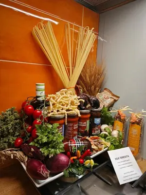 a tray filled with lots of vegetables and pasta at Teresita in Monreale
