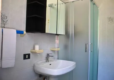 a bathroom with a sink and a shower at Villa Giorgia in Alcamo