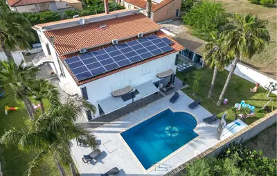 an aerial view of a house with solar panels on the roof at Cozy Home In Partinico in Partinico