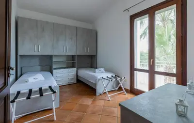 a hospital room with two beds and a window at Cozy Home In Partinico in Partinico