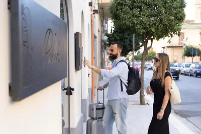 a man and a woman standing outside of a store at La Dimora dei Paladini in Bagheria