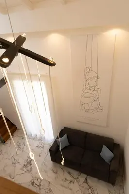 a living room with a couch and a ceiling at La Dimora dei Paladini in Bagheria
