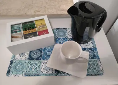 a table with a coffee pot and a cup on it at Casa Magarìa in Palermo
