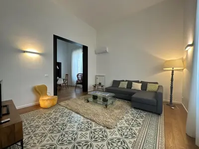 a living room with a couch and a table at Laura's Apartment in Palermo