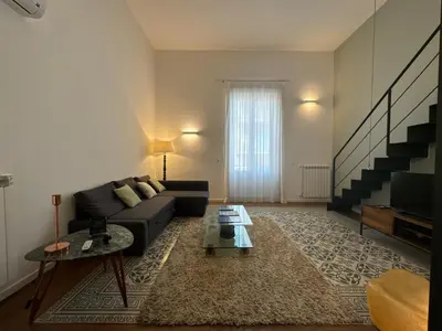 a living room with a couch and a table at Laura's Apartment in Palermo
