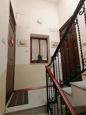 a staircase in a house with a window at Azizò, la Gialla in Palermo